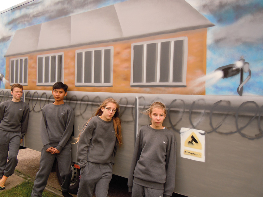 children-leaning-on-van